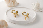 Ribbed Gold Bow & Pearl Stud Earrings